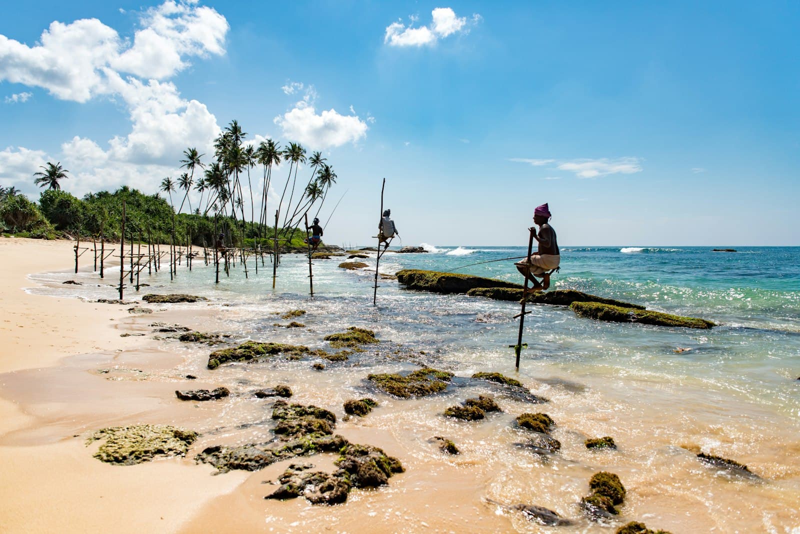 Travellers on coastal cliffs overlooking the Indian Ocean